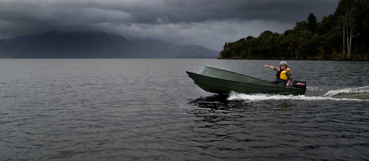 Wide shot of Te Radar boating at Lake Brunner