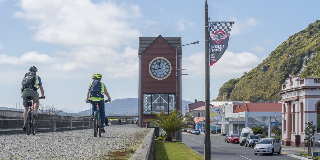Cycling along Mawhera Quay in Greymouth